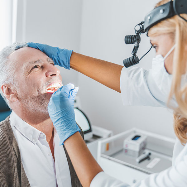 An oral surgery patient examined after treatment